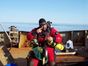 005 Getting kitted out to dive. Its amazing how fast the weather can changed on the Gerorges Banks, two hours later this blue sky was obscured by pea soup fog.