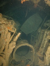 U869 Diesel Motor room, excape trunk on deck and daily fule tank wedged between engines.